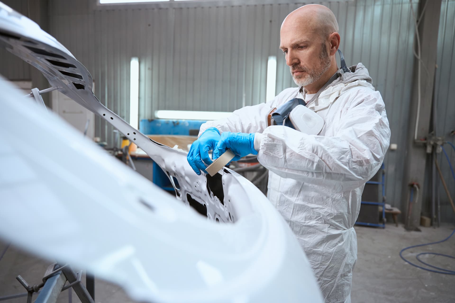 Car paint being corrected and polished to restore gloss and smooth finish